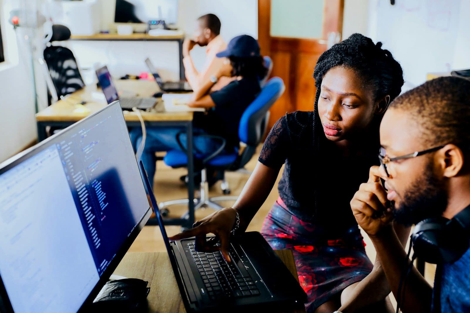 Team reviewing a website together on a laptop